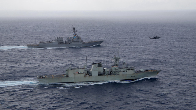 China has issued a warning to the US and Canada following the passage of warships through the Taiwan Strait.